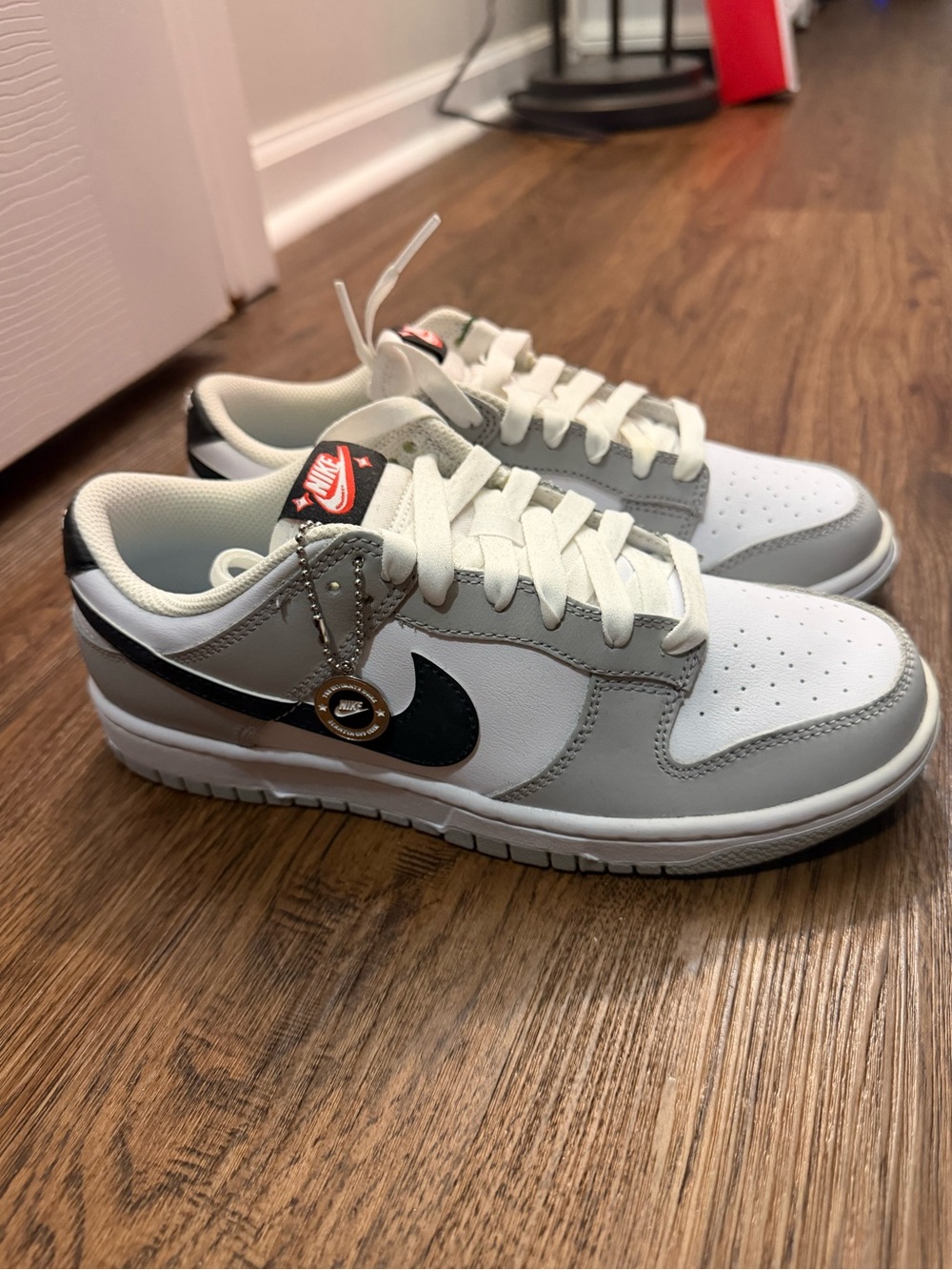 Nike Kids Low-Top Sneakers in White, Gray, and Black